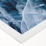 Art deco poster featuring a close-up of frost patterns in muted blue and white on rolled canvas.