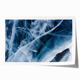 Close-up of frost patterns on ice, depicted in muted blue and white tones on a rolled canvas.