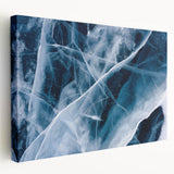 Close-up of frost patterns on a stretched canvas, featuring muted blue and white tones, suitable for kitchen wall art.