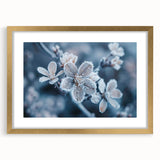Textured art of abstract frost design in gold frame with mat, featuring muted blue and white tones, ideal for bedroom art.