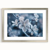 Abstract art print of frost patterns in muted gray and silver, framed with a silver mat.