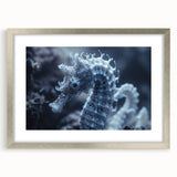 Abstract art print depicting frost designs in muted white and blue tones, framed in silver.