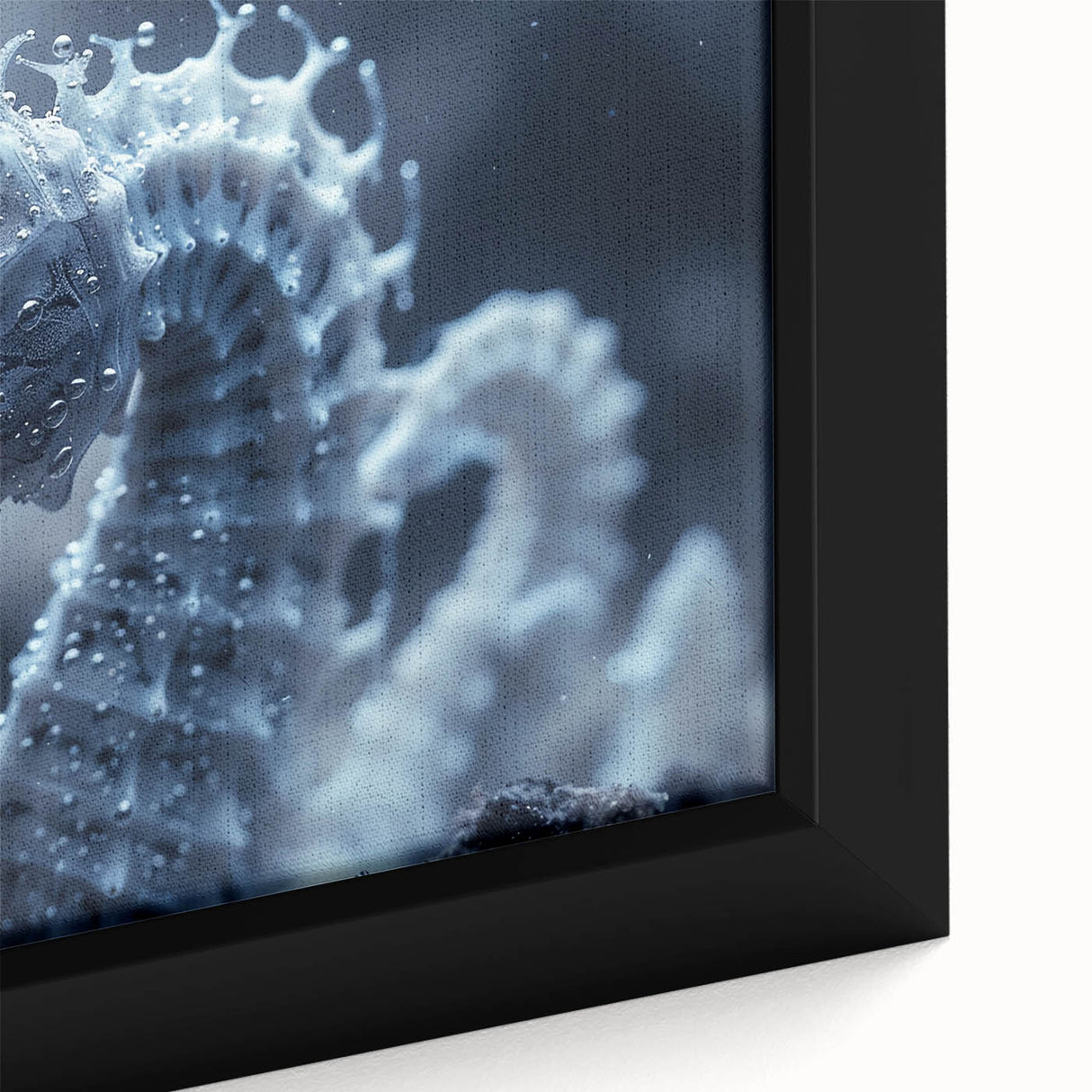 Close-up of black wall art featuring a textured frost design in vibrant colors on a framed canvas.