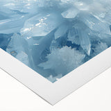 Art deco poster of intricate frost patterns in muted blue and white tones on rolled canvas.