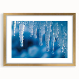 Textured art depicting abstract frost patterns in gray and white tones, framed in gold, ideal for bedroom art.