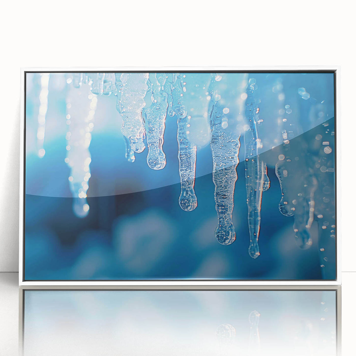 Large art print of a close-up ice frost design in muted blue and white tones on framed acrylic.