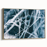 Framed canvas featuring a close-up of frost patterns in gray and gold tones.