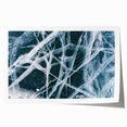 Close-up of frost patterns on ice, in muted blue and white tones, printed on rolled canvas.