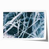 Close-up of frost patterns on ice, in muted blue and white tones, printed on rolled canvas.