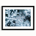 Extra large abstract art print depicting a frost design in vibrant blue and white tones on a black framed canvas.