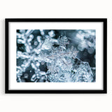 Extra large abstract art print depicting a frost design in vibrant blue and white tones on a black framed canvas.