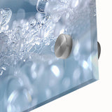 Close-up of frost patterns in muted gray and blue tones on acrylic glass.