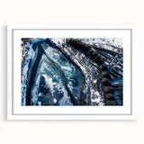 Extra large abstract art print featuring a close-up of frost patterns in gray and white tones, framed with a white mat.