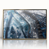 Mid-century modernist art depicting frost patterns in muted blue tones on a gold-framed acrylic.