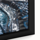 Close-up of textured black wall art depicting frost patterns on ice, framed canvas ideal for living room decor.