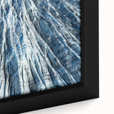 Close-up of textured black wall art featuring a frost design on a framed canvas.
