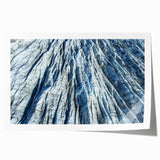Close-up of frost patterns on ice in muted gray and blue tones, printed on rolled canvas, suitable for art wall dining room.