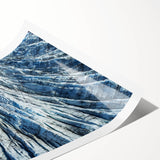 Extra large wall art featuring a close-up of frost patterns on ice, in muted blue and white tones.