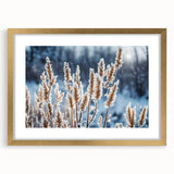 Textured art print featuring abstract frost patterns in subdued white and blue tones, encased in a gold frame with mat.