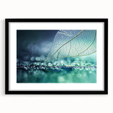 Extra large abstract art print of colorful, textured leaves, framed in black, ideal for living room decor.