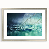 Textured art featuring close-up of leaves in green and brown tones, framed in silver, ideal for bedroom art.