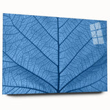 Large abstract wall art featuring close-up leaves design in green and yellow tones on acrylic glass.