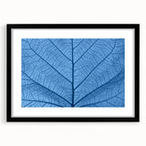 Extra large abstract art print featuring textured, colorful leaves design on a black framed canvas.