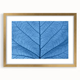 Extra large abstract art print featuring textured leaves in earth tones, framed in gold, ideal for living room decor.