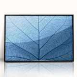 Framed acrylic print featuring a close-up of leaves in green and yellow tones, styled in a large abstract.