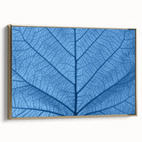 Framed canvas wall art featuring a close-up of leaves in black and gold tones, suitable for bedroom decor.