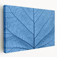 Close-up of green leaves on a stretched canvas, ideal for kitchen wall art with a natural theme.