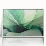 Close-up of green leaves in art deco style, acrylic print in white frame, suitable for modern nursery decor.