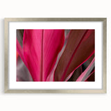 Textured art print of abstract leaves in silver frame, using a palette of green and brown, ideal for bedroom art.