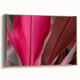 Framed canvas featuring close-up of leaves in muted green and gold tones, suitable as wall art for a bedroom.