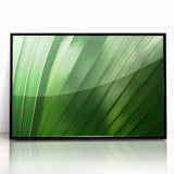 Large abstract wall art featuring close-up leaves design in green tones on framed acrylic, suited for modern home decor.
