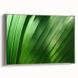 Framed canvas featuring a close-up of leaves in vibrant green tones, ideal for adding a natural element to a living room.