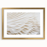 Extra large abstract art print featuring textured leaf designs in gold and green, framed with mat.