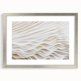 Textured art print of abstract leaves in silver frame, using muted green and brown tones, ideal for bedroom wall decor.