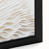 Close-up of textured black wall art featuring colorful leaves, on a framed canvas, suitable for living room decor.