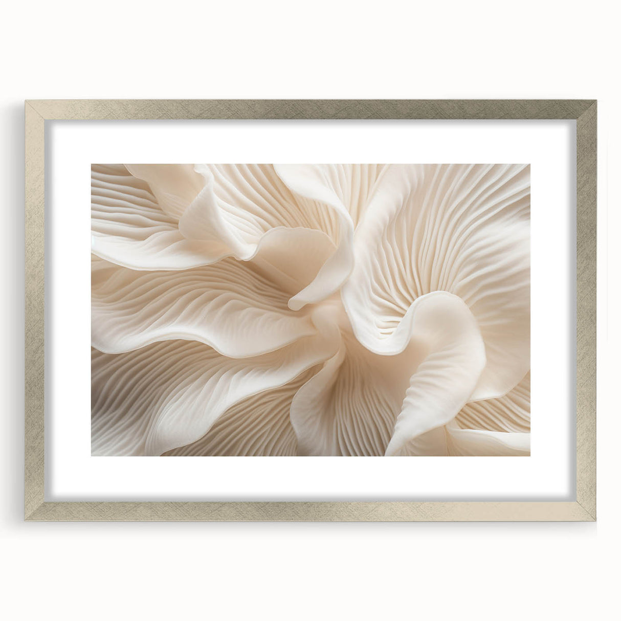 Textured abstract art print of overlapping leaves in muted green shades, framed in silver, ideal for bedroom art.