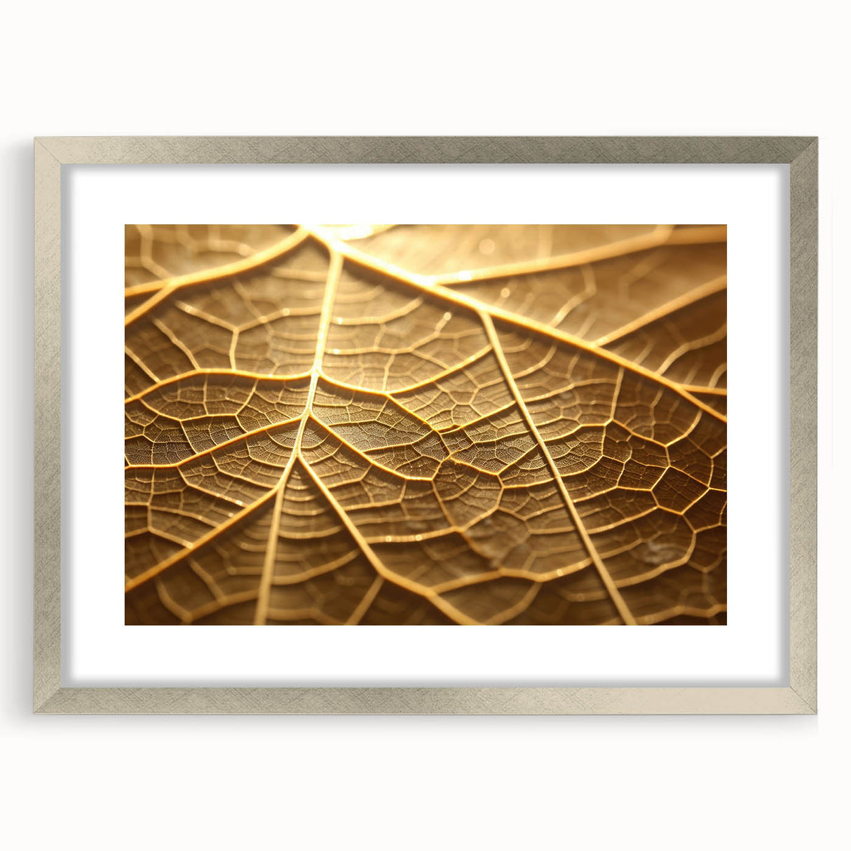 Close-up abstract textured art of leaves in muted green and brown tones, framed in silver, ideal for bedroom art.