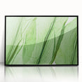 Large abstract wall art featuring close-up leaf designs in green and brown, framed in black acrylic.