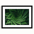 Extra large abstract art print featuring a close-up of leaves in vibrant colors, textured on a black framed canvas.
