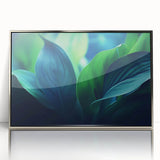 Mid-century modernist art featuring close-up of leaves in muted green tones, framed in silver acrylic.