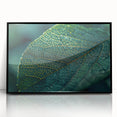 Large abstract wall art featuring close-up leaves design in green and brown tones, framed in black acrylic.