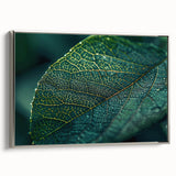 Framed canvas of a close-up leaf design in vibrant green and yellow, ideal for adding a natural touch to any living space.