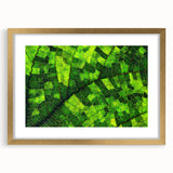 Extra large abstract art print featuring close-up leaf designs in textured greens and golds, framed with a golden mat.