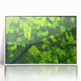 Close-up of green leaves in a minimalist style on a framed acrylic, ideal for modern art wall decor in a nursery.
