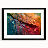 Colorful abstract art print featuring a close-up of textured leaves in green and yellow, framed in black.