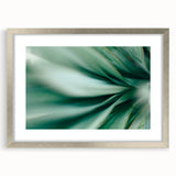 Textured art of abstract leaves in muted green and silver, framed with mat, ideal for bedroom art.
